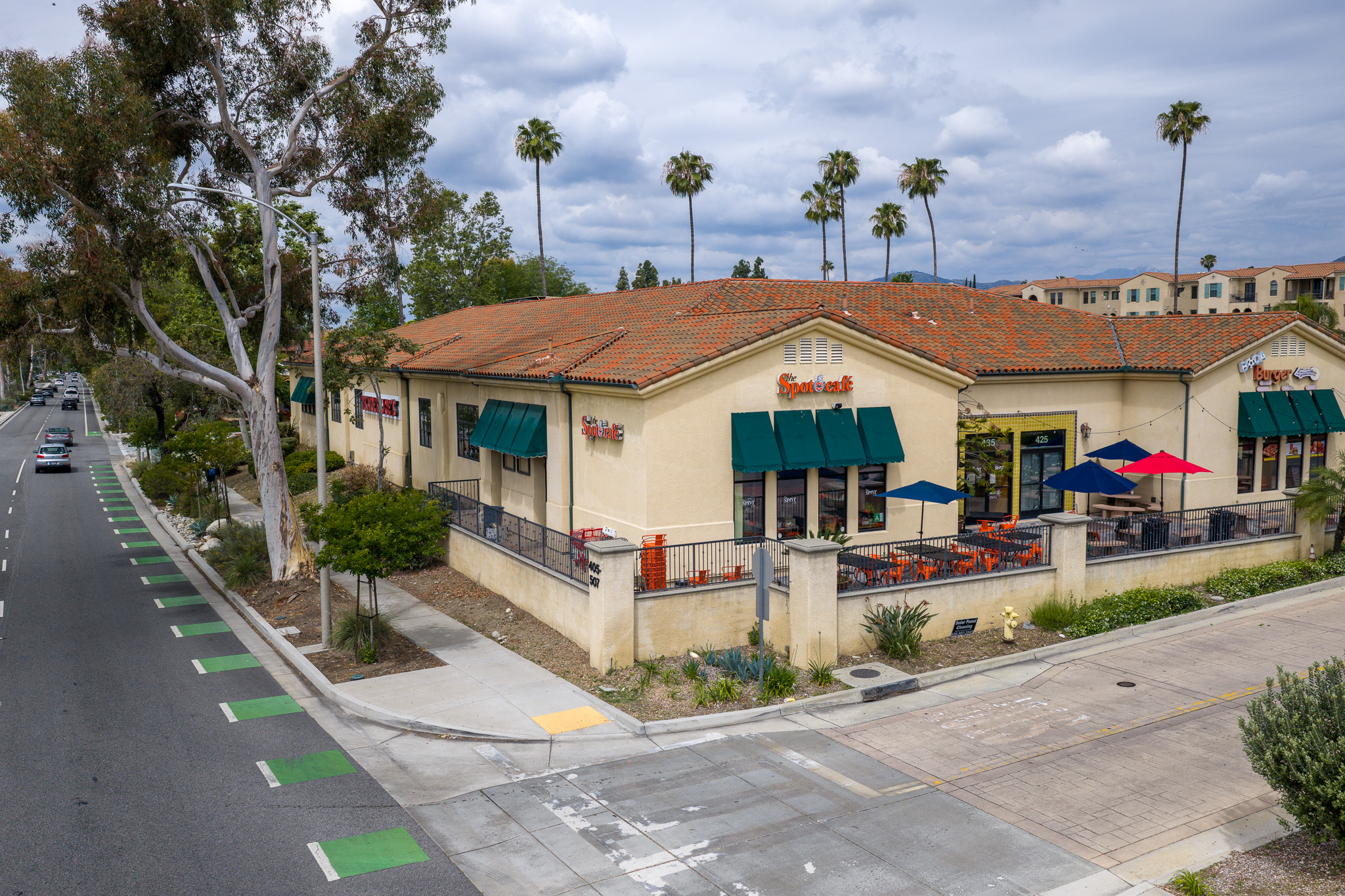 Aerial view of The Spot Cafe and neighboring shops in Pomona
